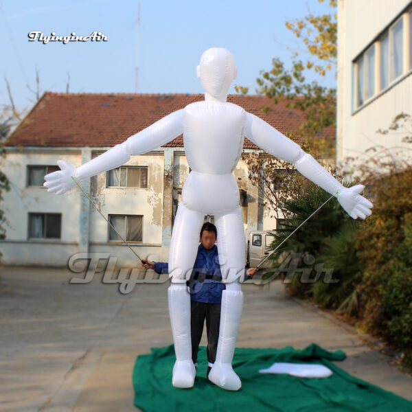 front of walking white inflatable mannequin puppet