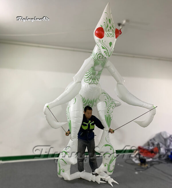 front of white walking inflatable mantis puppet