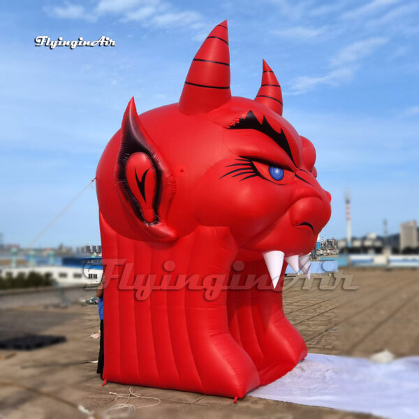 side of red inflatable devil tunnel