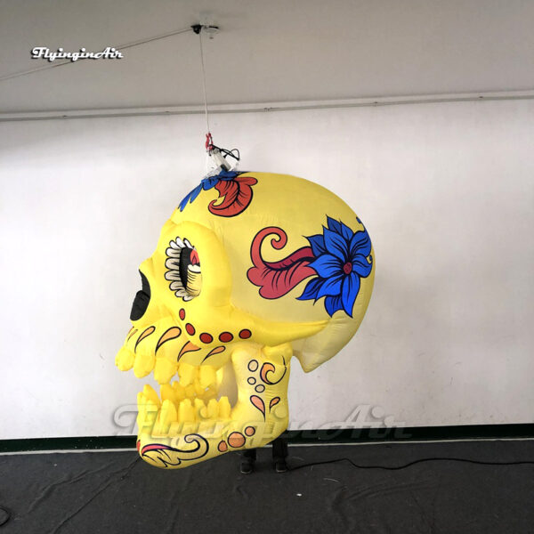 side of hanging yellow inflatable skull