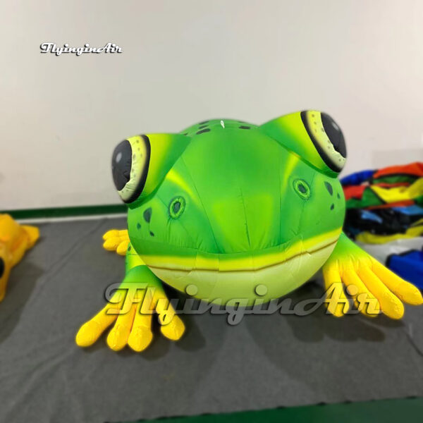 front of green inflatable frog balloon