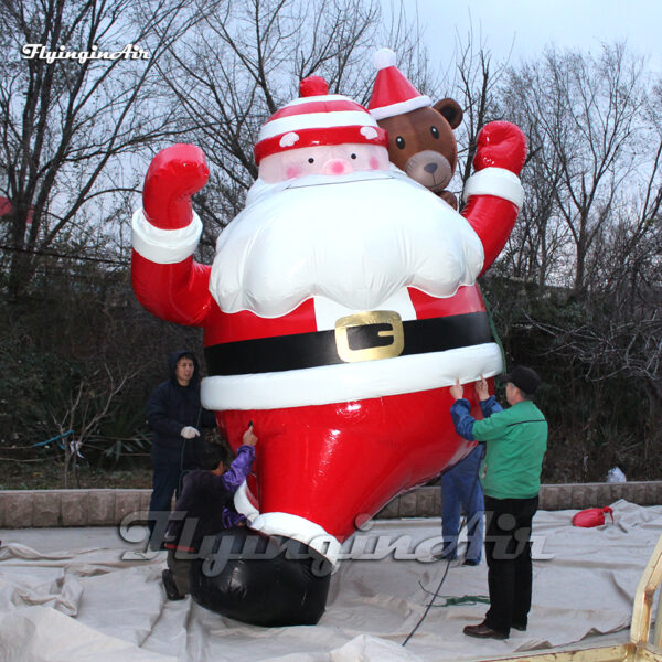 hanging inflatable santa with bear