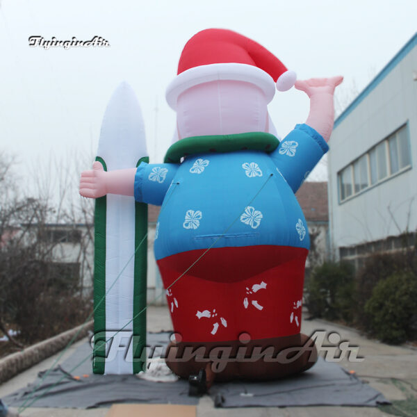 back of inflatable santa with a snowboard