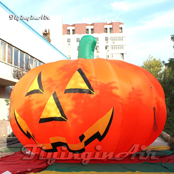 inflatable pumpkin head balloon on the ground
