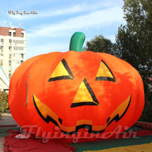 large inflatable pumpkin halloween balloon on ground