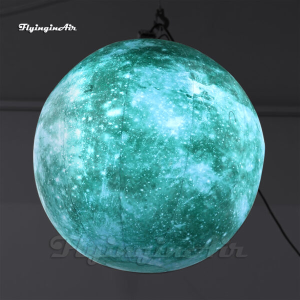 large hanging green inflatable planet ball