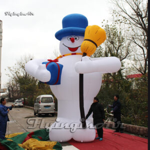 large inflatable snowman model with a broom