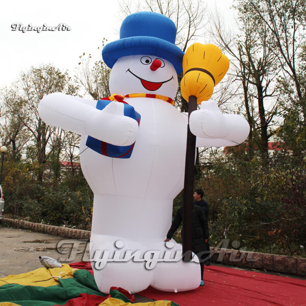 inflatable cartoon snowman with a broom