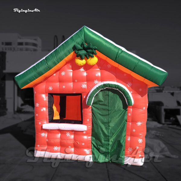 red inflatable christmas house with blower