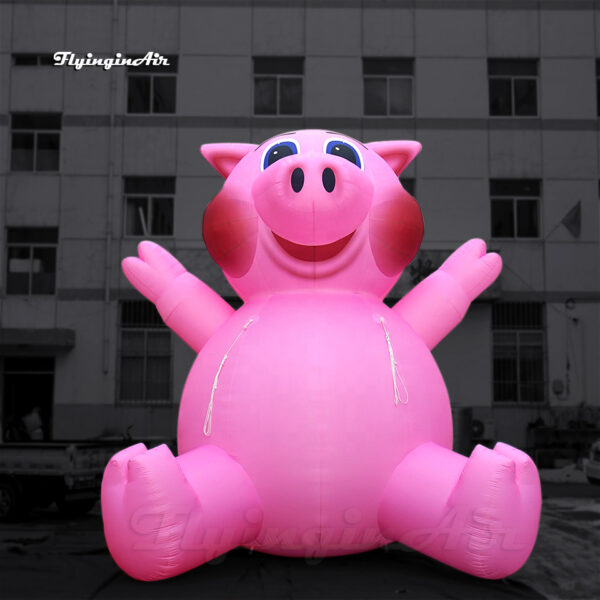 giant inflatable pink pig balloon sitting on the ground