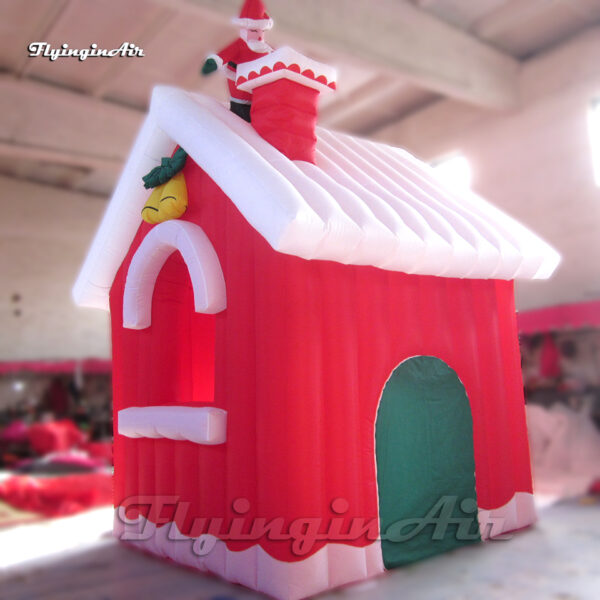 red inflatable christmas house with santa