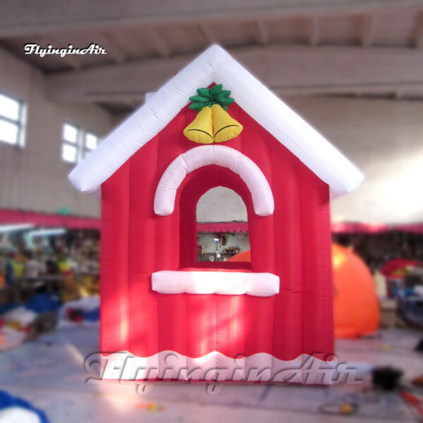 red inflatable village cottage for christmas