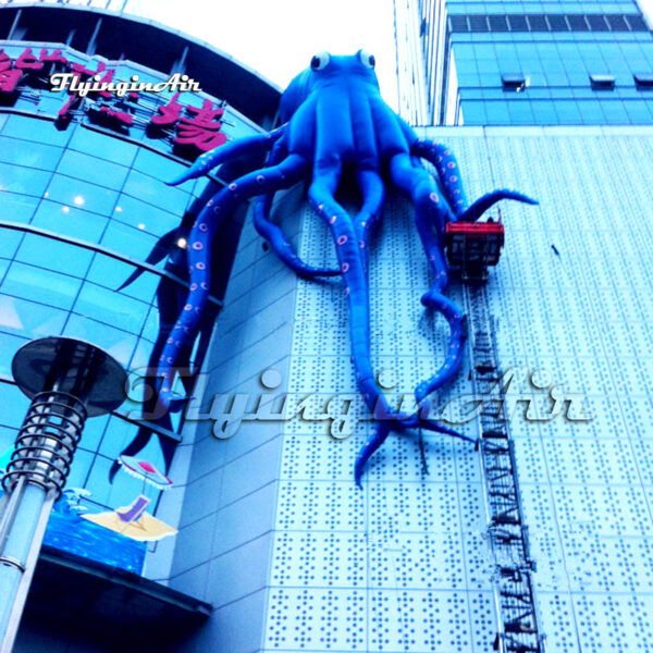large-blue-inflatable-octopus-on-building-wall