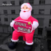 giant-red-inflatable-santa-holding-a-sign