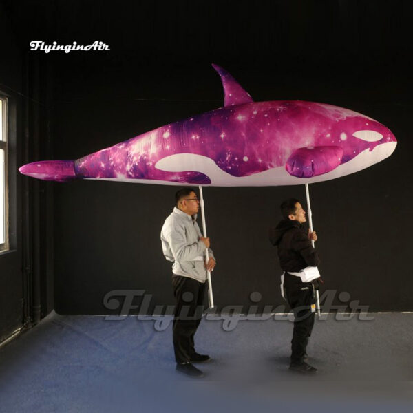 purple-holding-inflatable-killer-whale-puppet