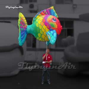 large colorful holiding inflatable tropical fish puppet with a pole