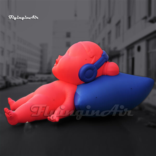 pink inflatable doll sleeping baby with a pillow and headphone