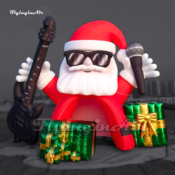 red giant inflatable santa tunnel holding a guitar and microphone