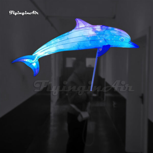holding illuminated inflatable dolphin puppet parade sea animal balloon