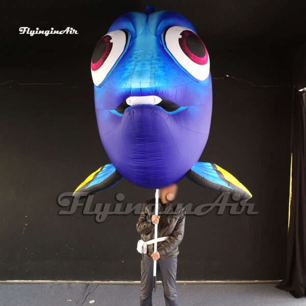 holding giant inflatable Dory Puppet cartoon sea animal model for event