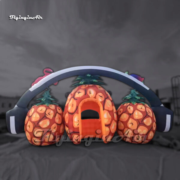large inflatable pineapple dj booth with a headphone for carnival stage