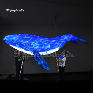 parade sea animal balloon holding inflatable whale puppet