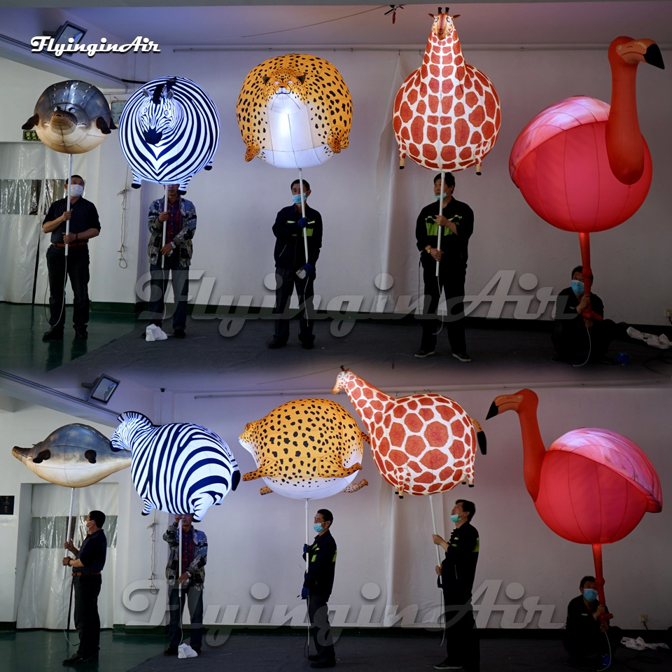 walking parade animal balloon holding inflatable griaffe, leopard, zebra, flamingo, crocodile puppet