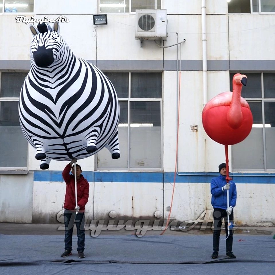 parade animal balloon holding inflatable zebra, flamingo puppet