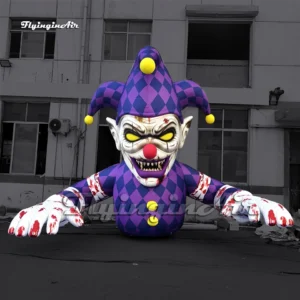 Front view of a 6m giant inflatable horror clown air blow up scary jester with yellow eyes, purple jester hat, and bloody claws, ideal for Halloween and haunted house decorations.
