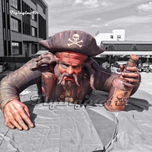 Front view of a 5m giant inflatable pirate captain holding a skull whiskey bottle, with a detailed pirate hat and red bandana, ideal for Halloween and bar promotions.
