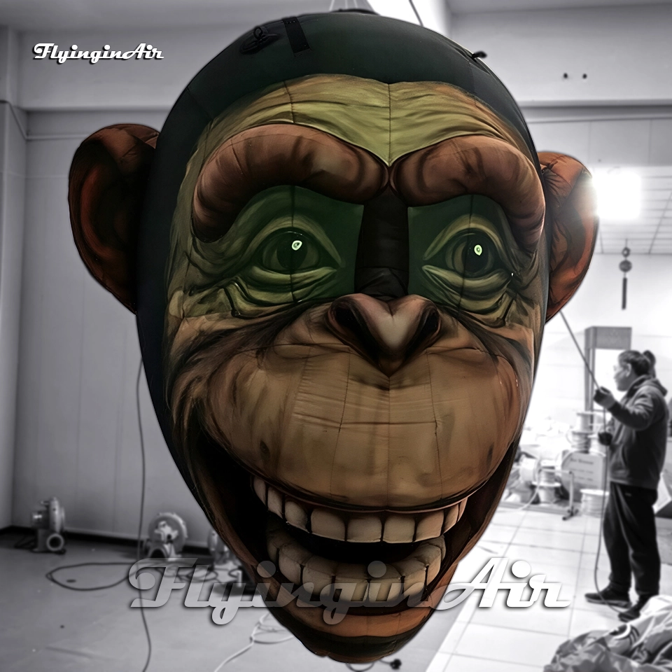 Front view of a custom inflatable monkey head with LED light, perfect for party and festival props.