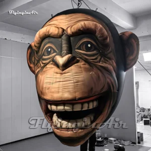 Close-up of a giant inflatable ape monkey head showing detailed 3D facial features and sturdy plain cloth construction.