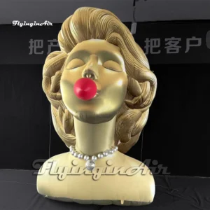 Front view of a 3m pop art giant inflatable woman bust sculpture with golden hair, a red bubble, and a pearl necklace, ideal for art exhibitions and mall decorations.