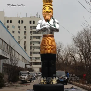 Front view of a 10m giant inflatable ancient pharaoh statue with a golden crown and silver body, ideal for museum exhibitions and cultural festivals.