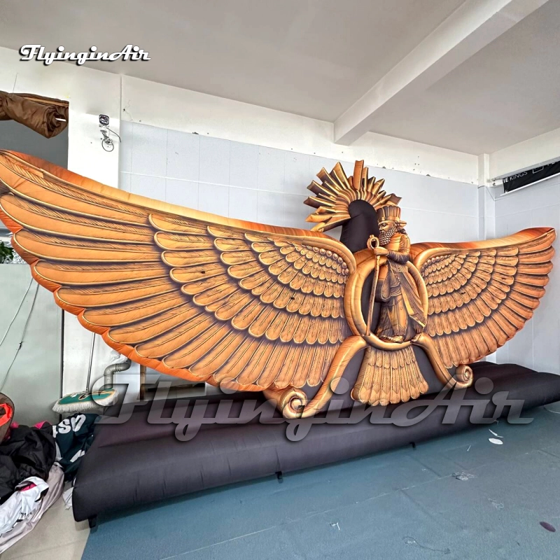 Close-up of a giant inflatable Faravahar model showing realistic golden printing and the sunburst crown, perfect for outdoor advertising.