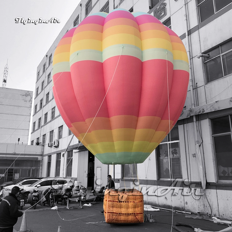 Close-up of a giant inflatable rainbow hot air balloon model showing vibrant 3D printing and sturdy Twill cloth construction, perfect for party events.