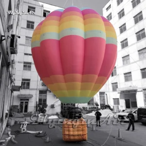 Side view of a custom inflatable hot air balloon showing detailed colorful stripes and a realistic basket, available for wholesale and outdoor advertising.